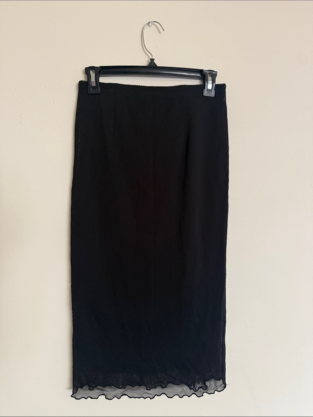 Elegant Black Midi Skirt with Subtle Ruffle Hem